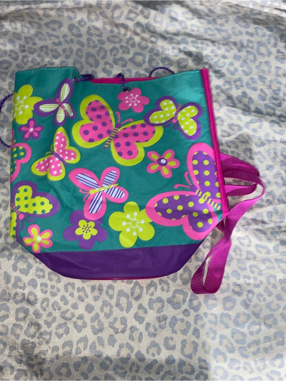 Vibrant buttery and floral pattern with a purple bottom and pink straps
